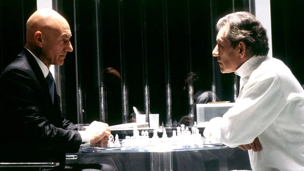 Professor Xavier and Magneto sit across a transparent chessboard in Magneto's prison.